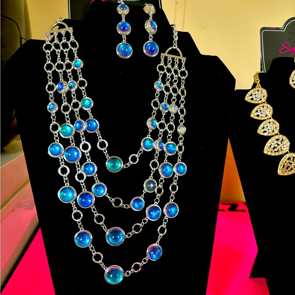 silver necklace with matching earrings